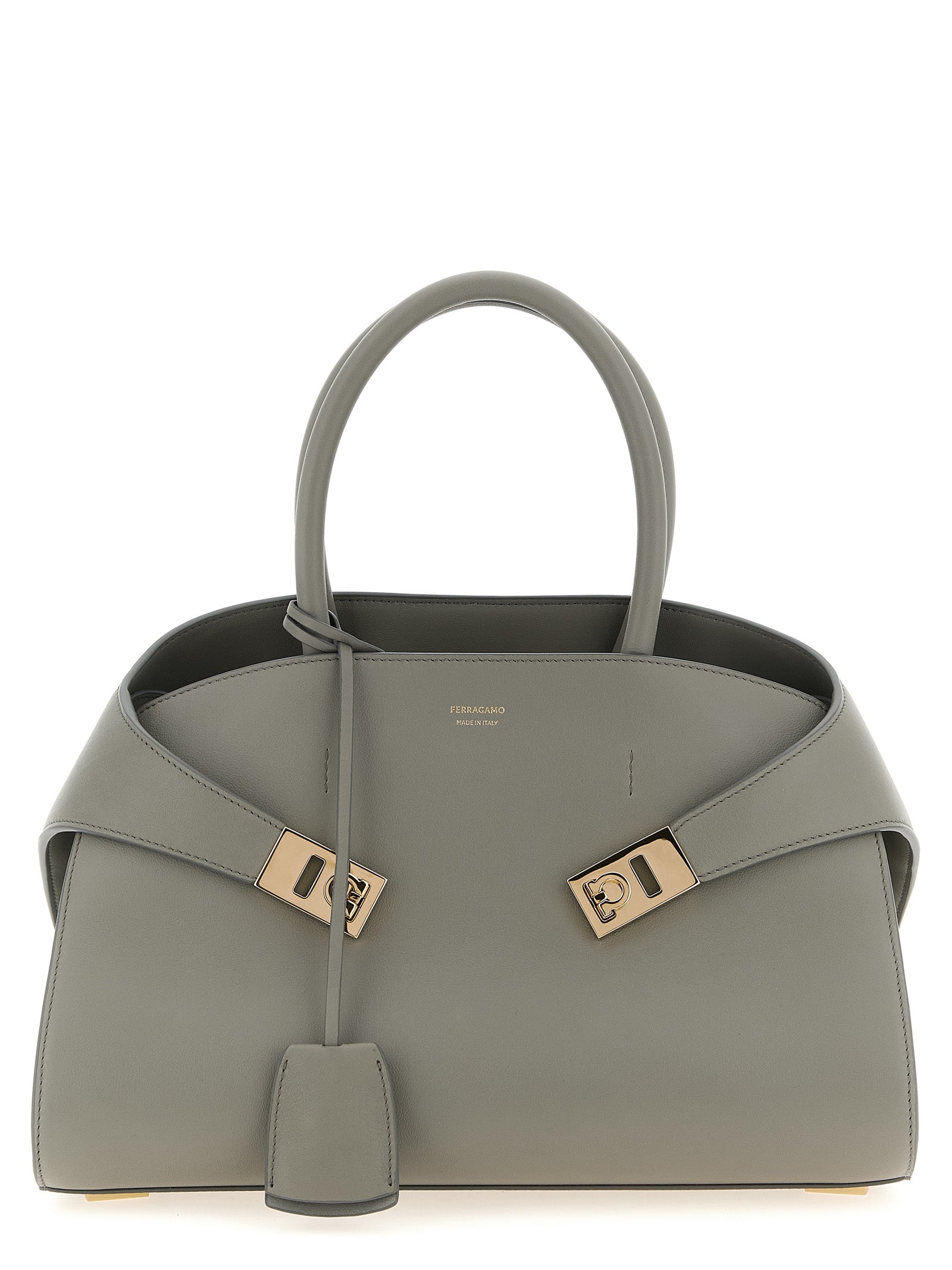 Ferragamo Hug Medium Handbag in Ash Grey natural-grain calfskin leather with gold Gancio buckles at The Exclusive Line Singapore.