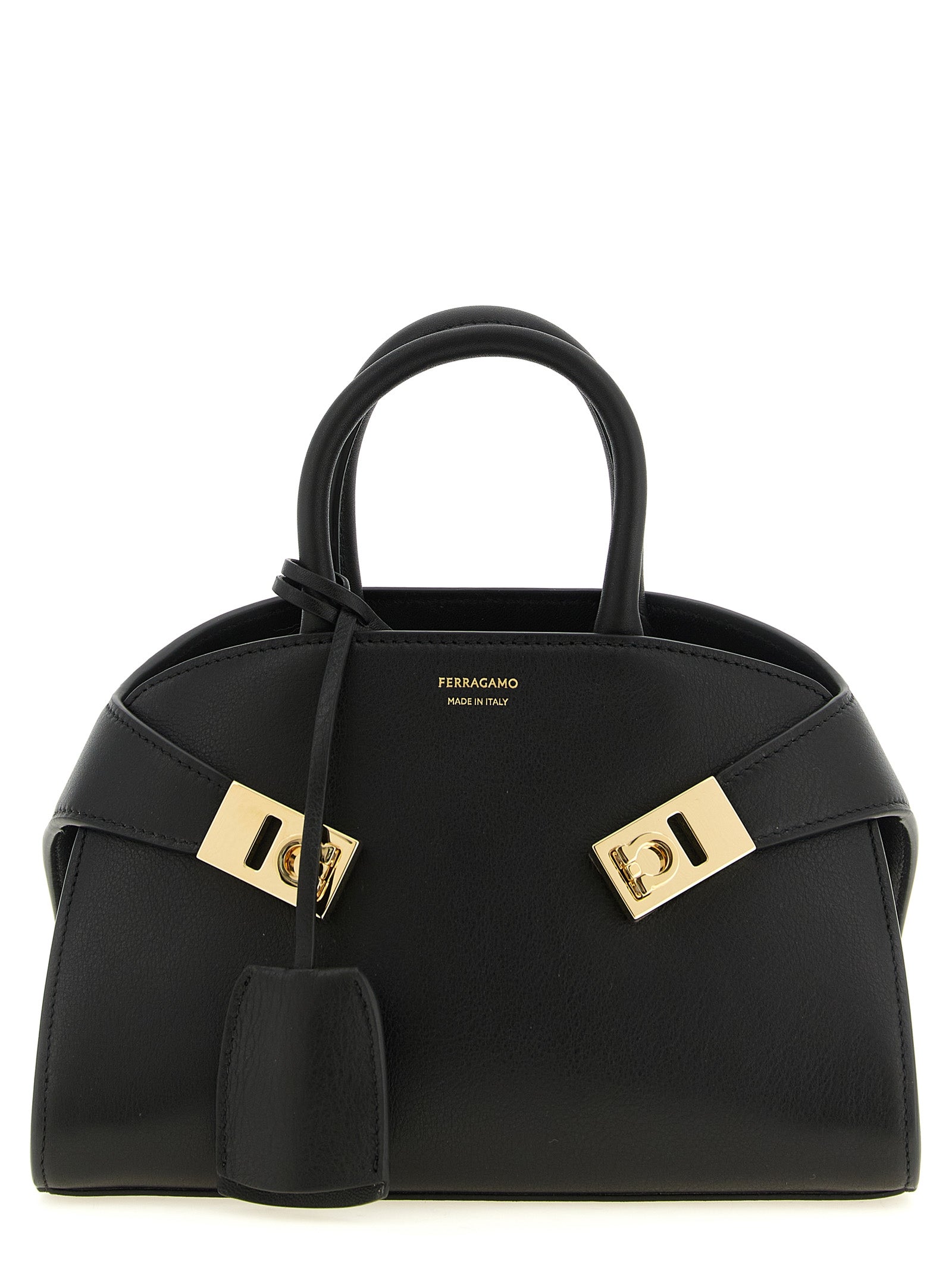 Ferragamo Hug XS handbag in black grained calfskin leather with gold-tone Gancio buckles.
