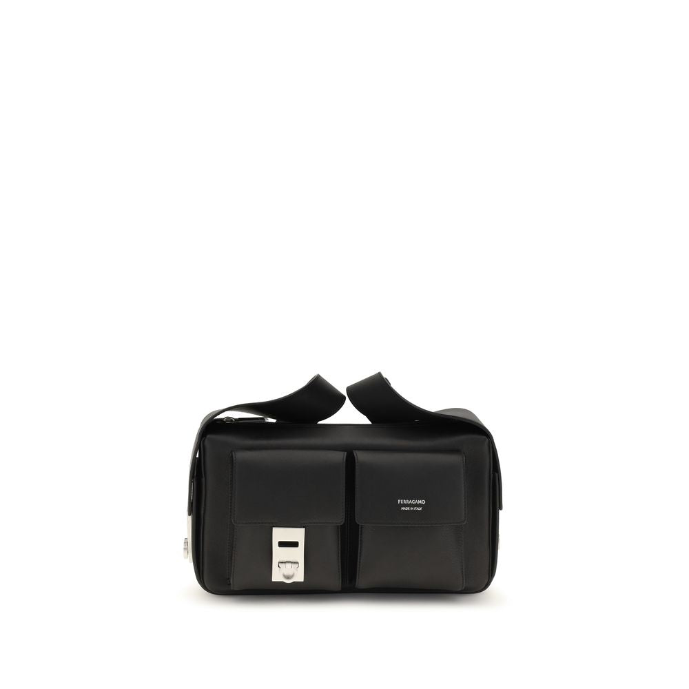 Ferragamo Medium Utility Shoulder Bag in black calfskin leather featuring signature Hug buckles and front flap pockets.
