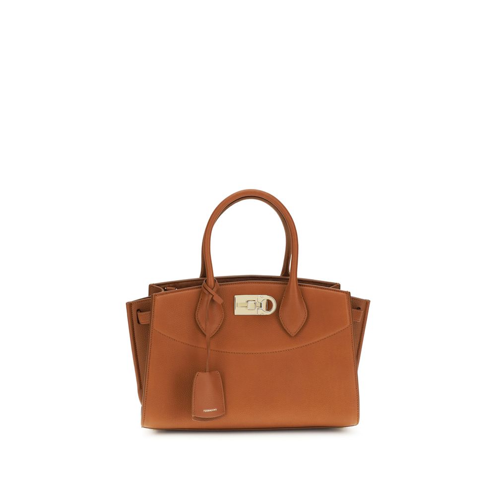 Ferragamo New Studio Medium Soft Bag in Cognac hammered calfskin leather with gold Gancio slider clasp at The Exclusive Line Singapore.