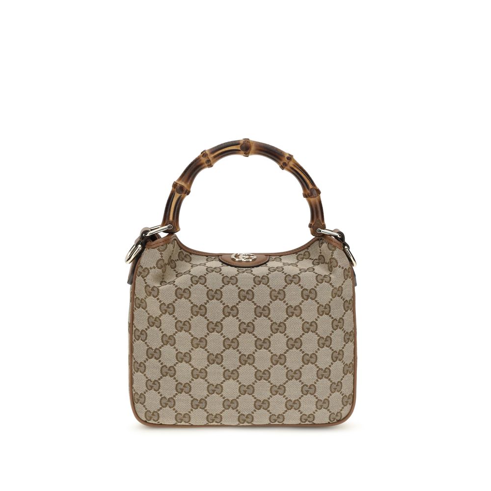 Gucci Diana Small Shoulder Bag in beige and brown GG canvas featuring the iconic bamboo top handle and light gold-toned Double G hardware.