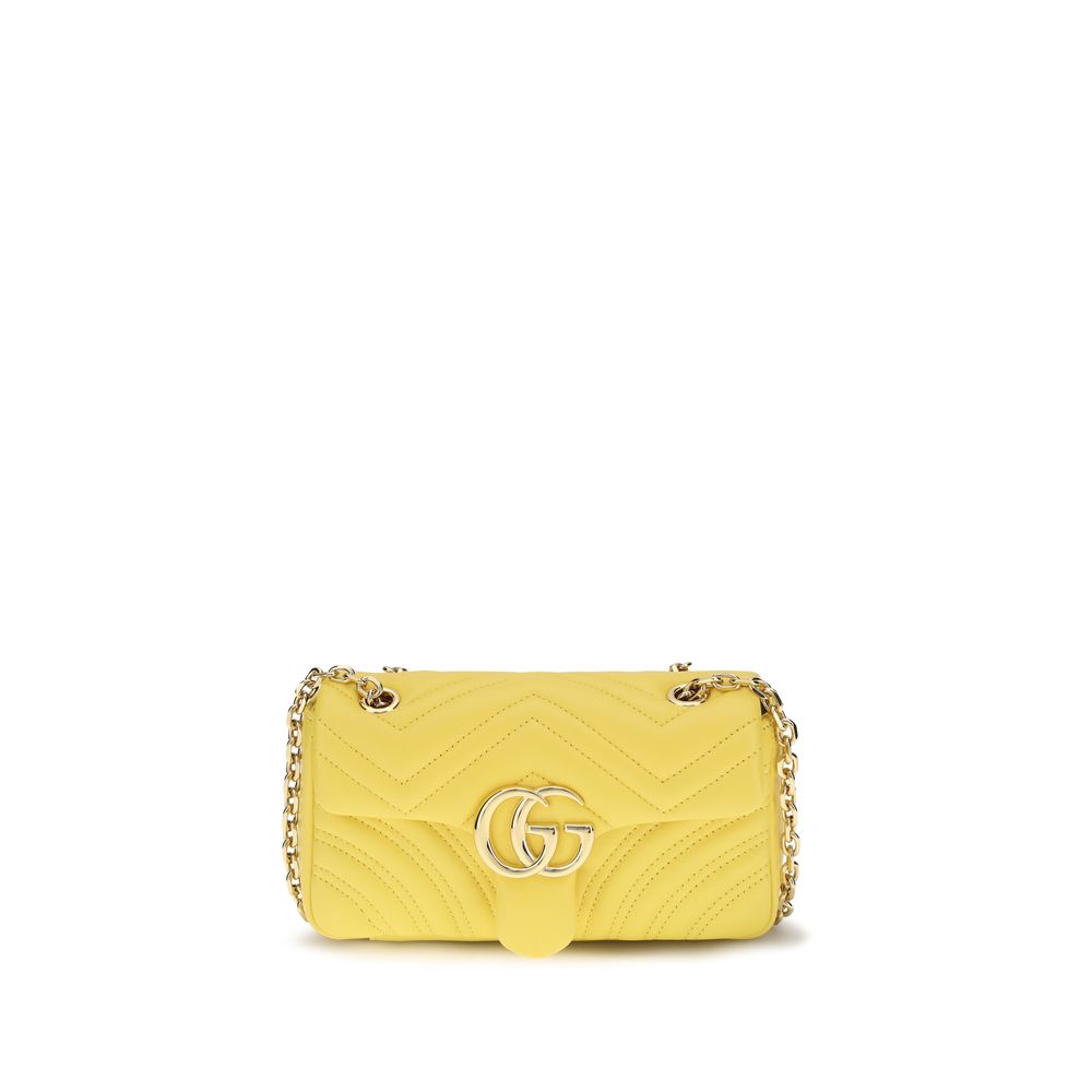 Gucci GG Marmont Small Shoulder Bag in yellow chevron matelassé nappa leather with gold-toned sliding chain strap and Double G hardware.