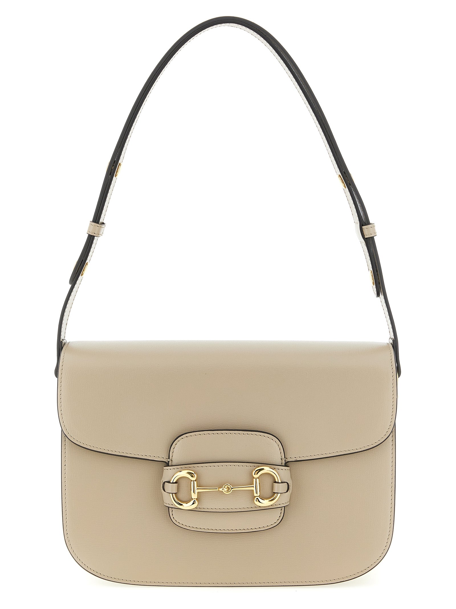 Gucci Horsebit 1955 Medium Shoulder Bag in beige leather showing iconic gold-toned horsebit hardware and front flap closure.