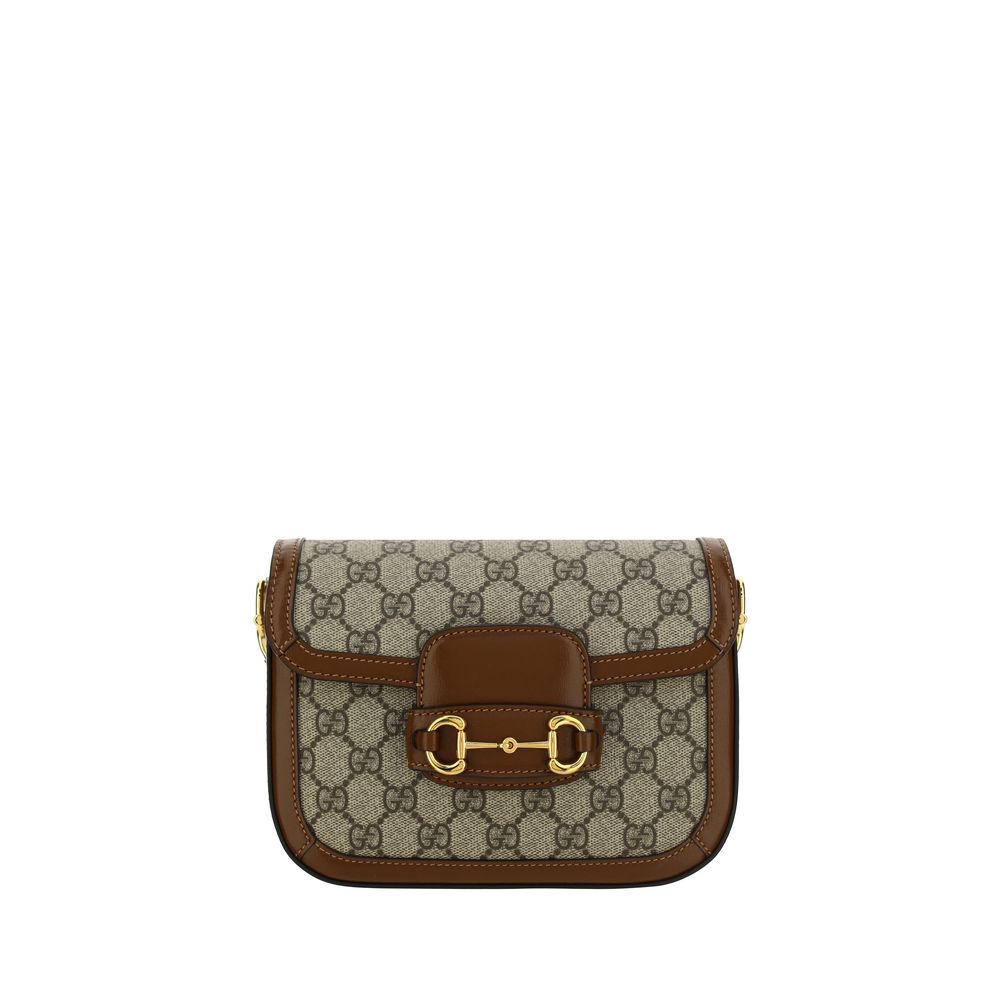 Gucci Horsebit 1955 Small Shoulder Bag in GG Supreme canvas with iconic gold Horsebit hardware, featuring its interchangeable brown leather and signature Web straps.
