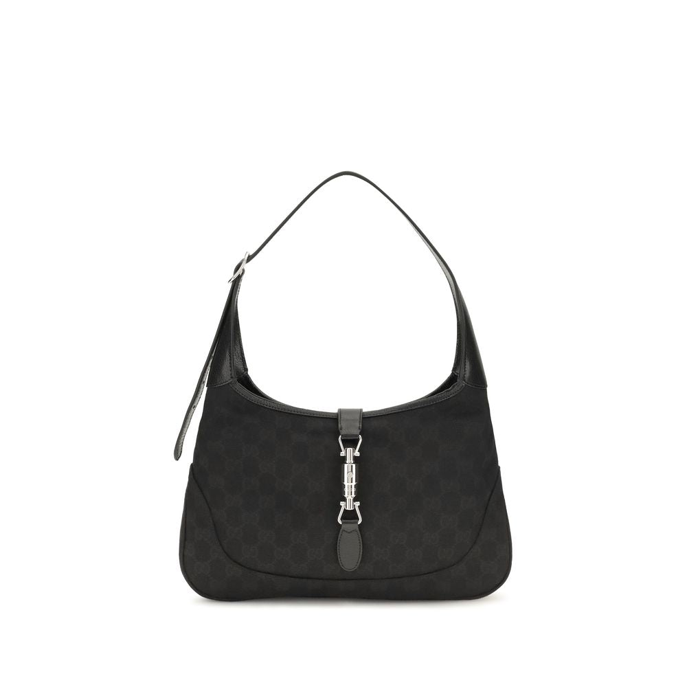 Gucci Jackie 1961 Medium Shoulder Bag in black GG canvas featuring black leather trim and the signature silver-toned piston closure.