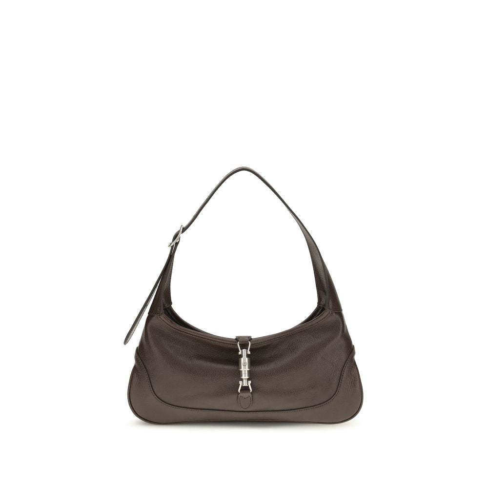 Gucci Jackie Slim Medium Shoulder Bag in dark brown hand-aged grainy leather featuring a palladium-toned piston closure and relaxed silhouette.