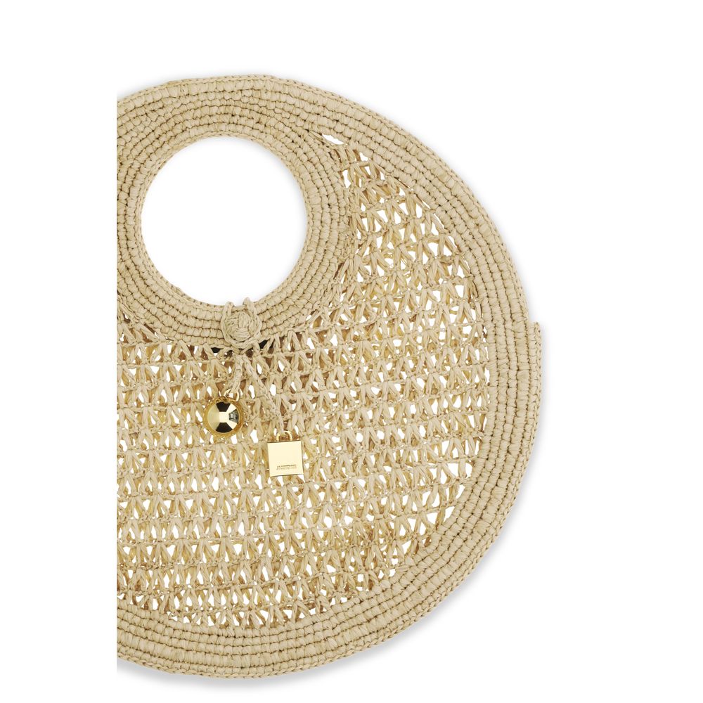 Close up of Jacquemus Le Petit Rond Spiaggia circular natural raffia handbag from The Exclusive Line Singapore.