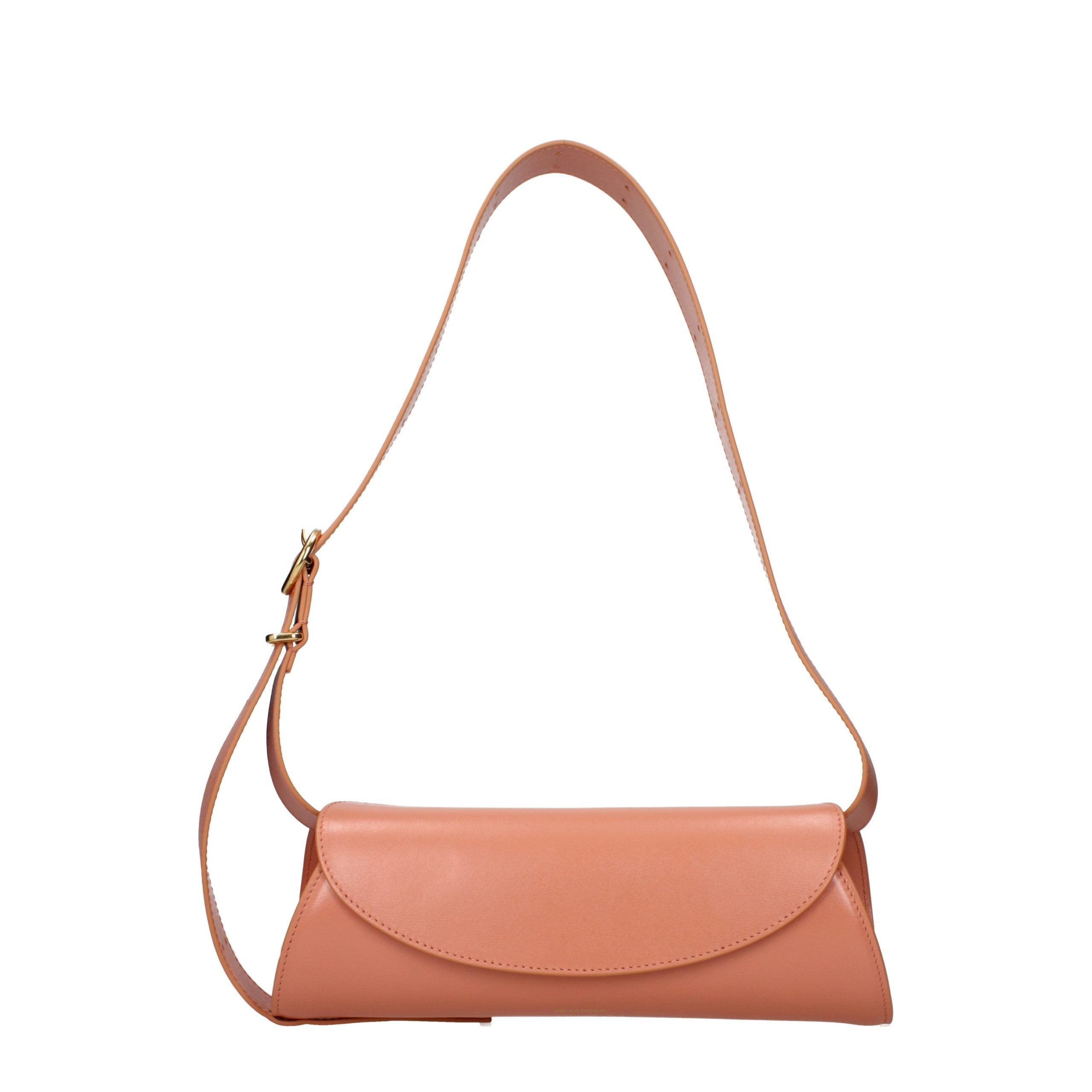 Jil Sander Cannolo Small Bag in salmon pink calf leather showing its signature cylindrical shape.