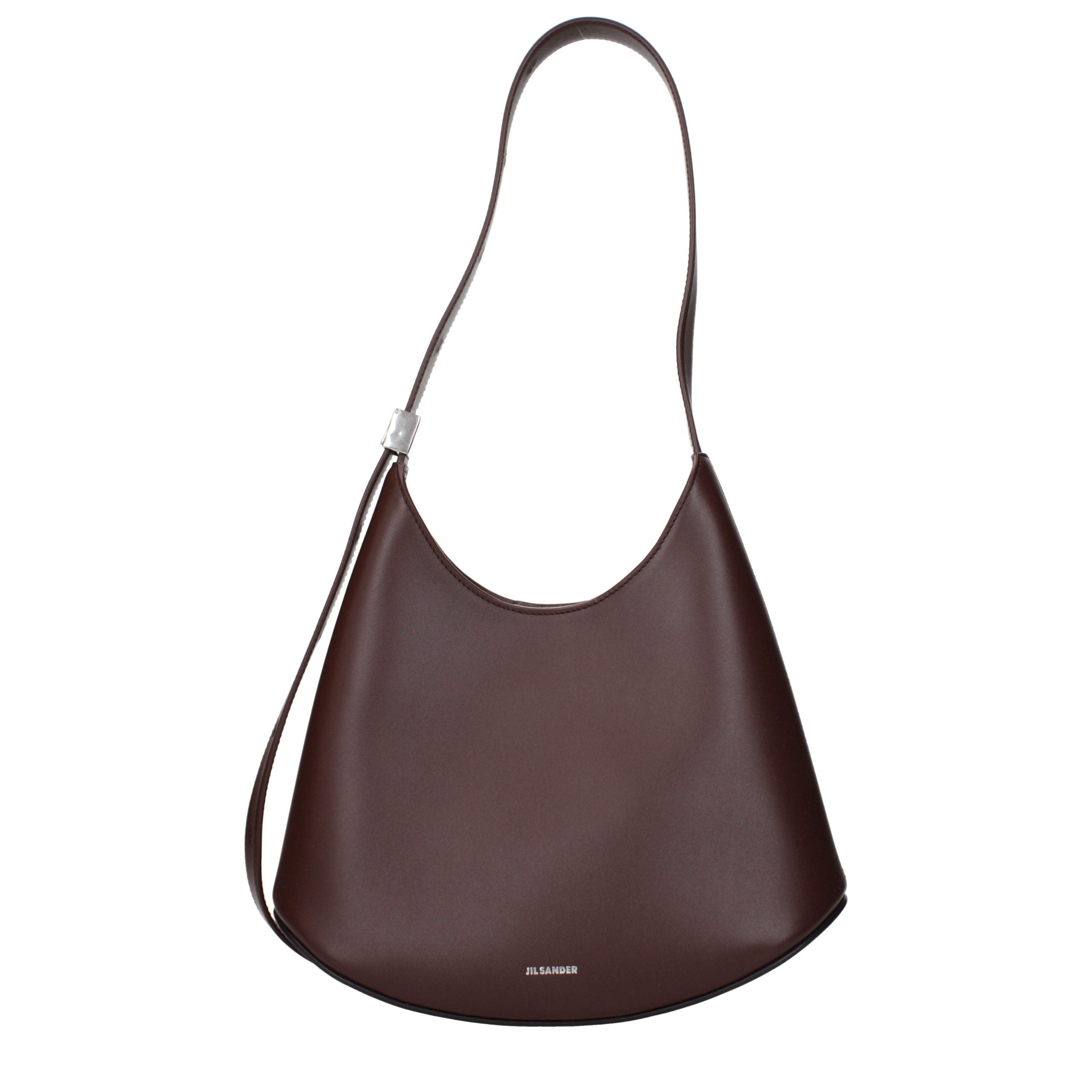 Jil Sander Eldorado Small Bag in mahogany brown calf leather with a curved vegetable-tanned base.