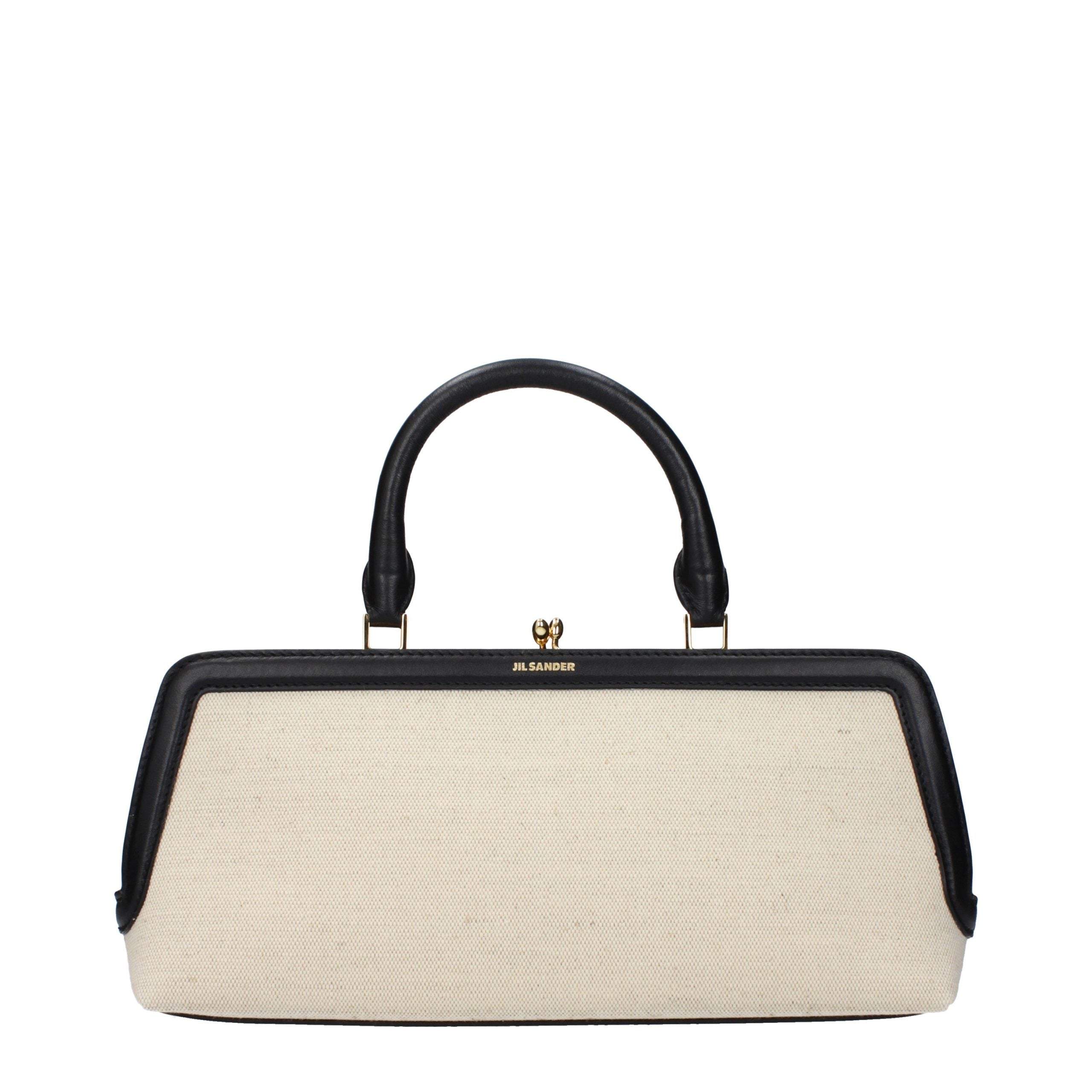 Jil Sander Goji Small handbag in beige canvas with black leather trim and gold clip closure.