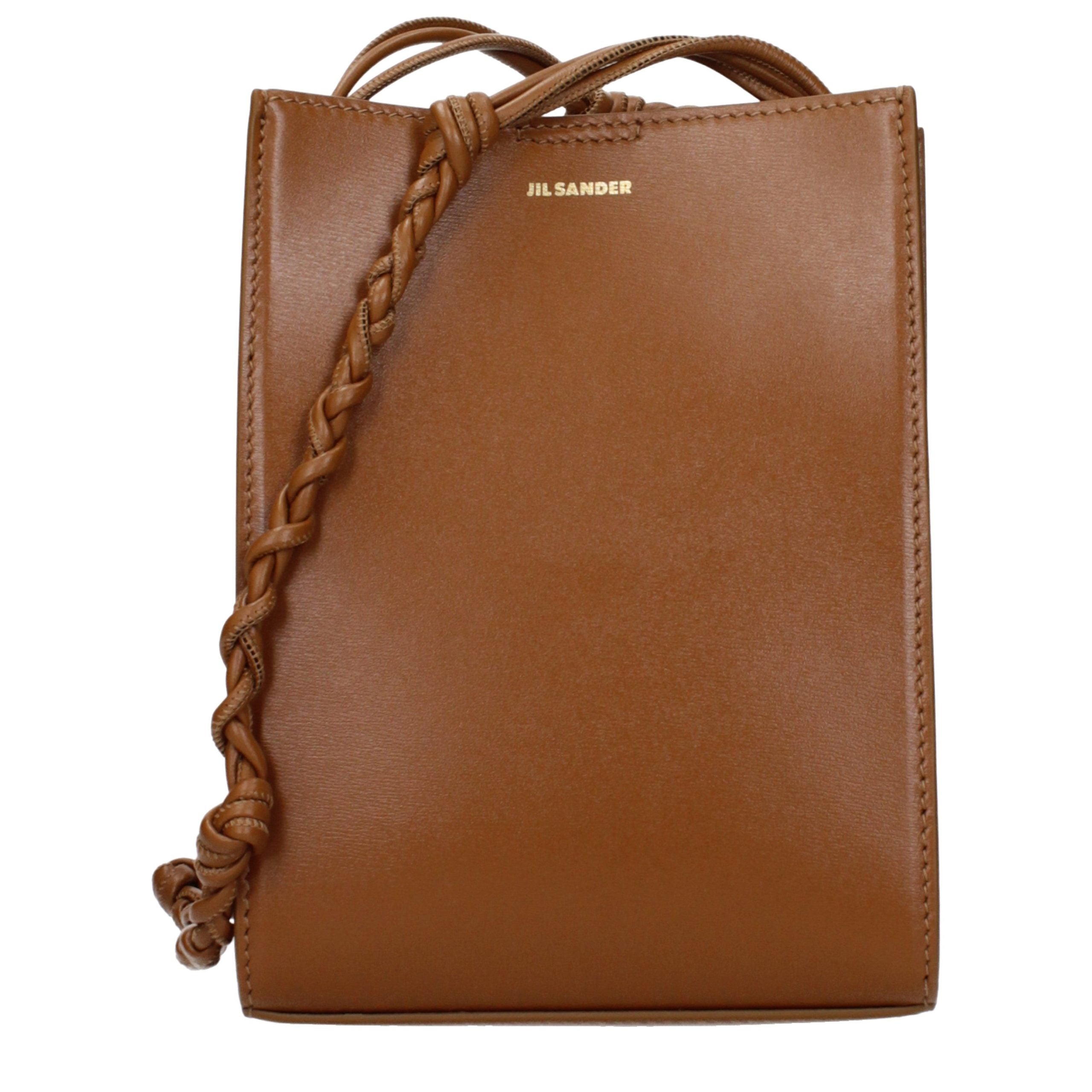 Jil Sander Tangle Small Shoulder Bag in tan brown calf leather featuring a hand-knotted shoulder strap.