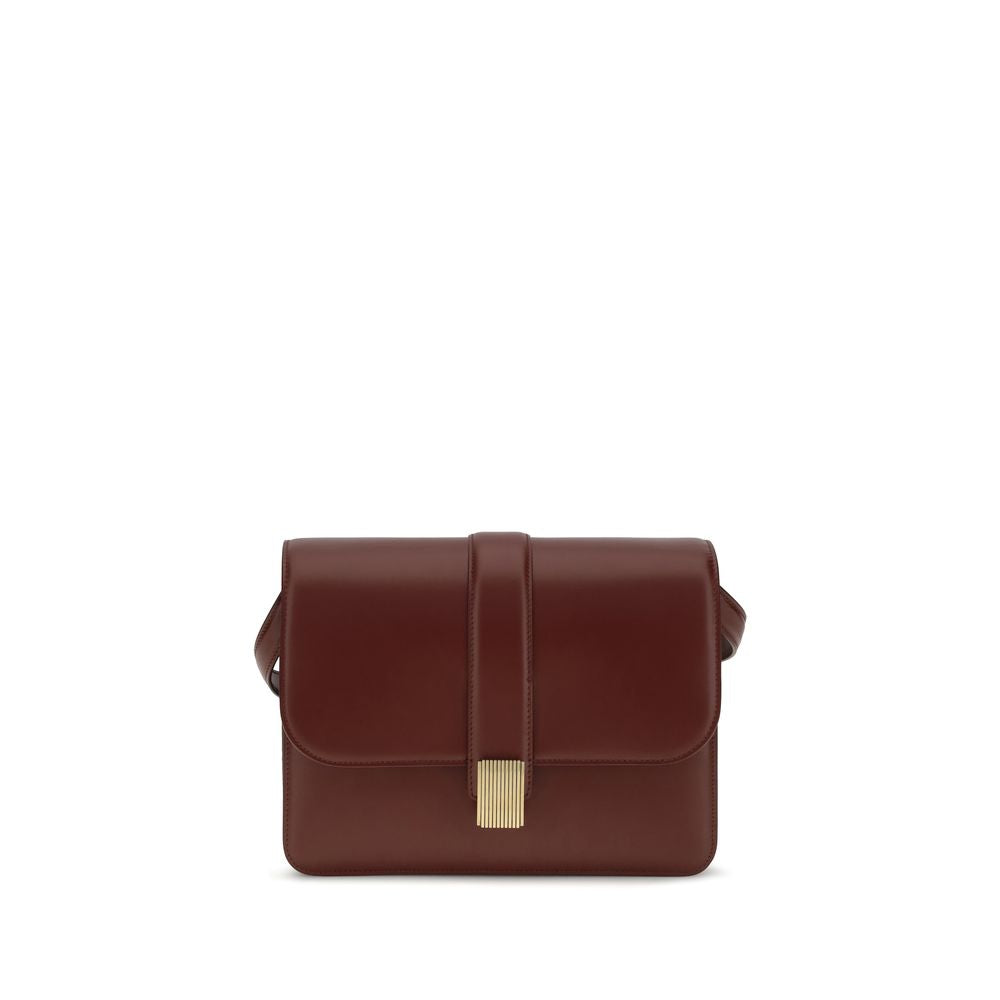Khaite Blake crossbody bag in structured oxblood box calf leather featuring gold Empire hardware and adjustable shoulder strap.