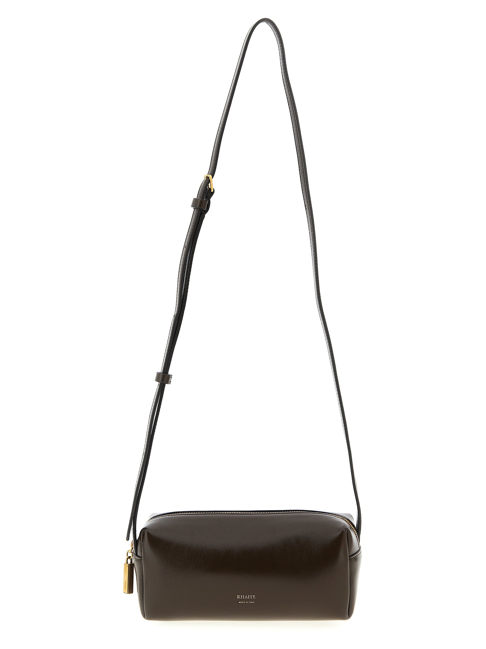 Khaite Kye Mini Crossbody Bag in rich dark brown calfskin leather with a sleek east-west shape, adjustable shoulder strap, and fine gold embossed branding details.