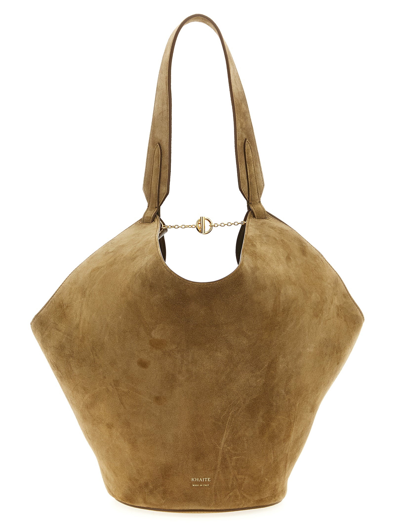 Khaite Small Lotus Tote in velvety mud brown suede, featuring a unique fluid draped scarf-inspired shape with an integrated top handle and a stable round base.