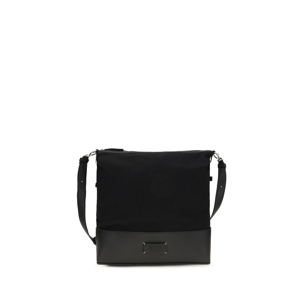 Maison Margiela 5AC Hobo Small bag in black embossed grainy leather featuring a fluid canvas top, numeric logo label, and adjustable strap.