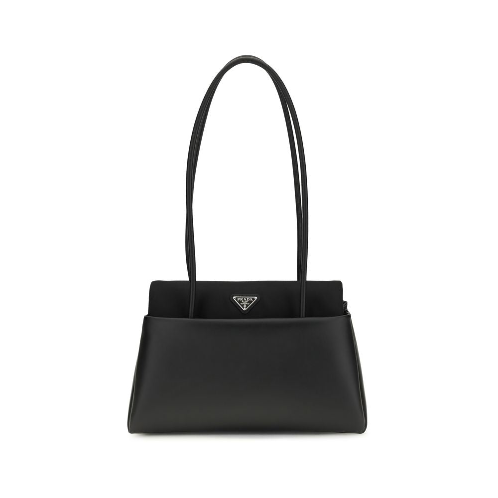 Prada Passage medium leather bag in black with Re-Nylon flap and triangle logo - The Exclusive Line Singapore