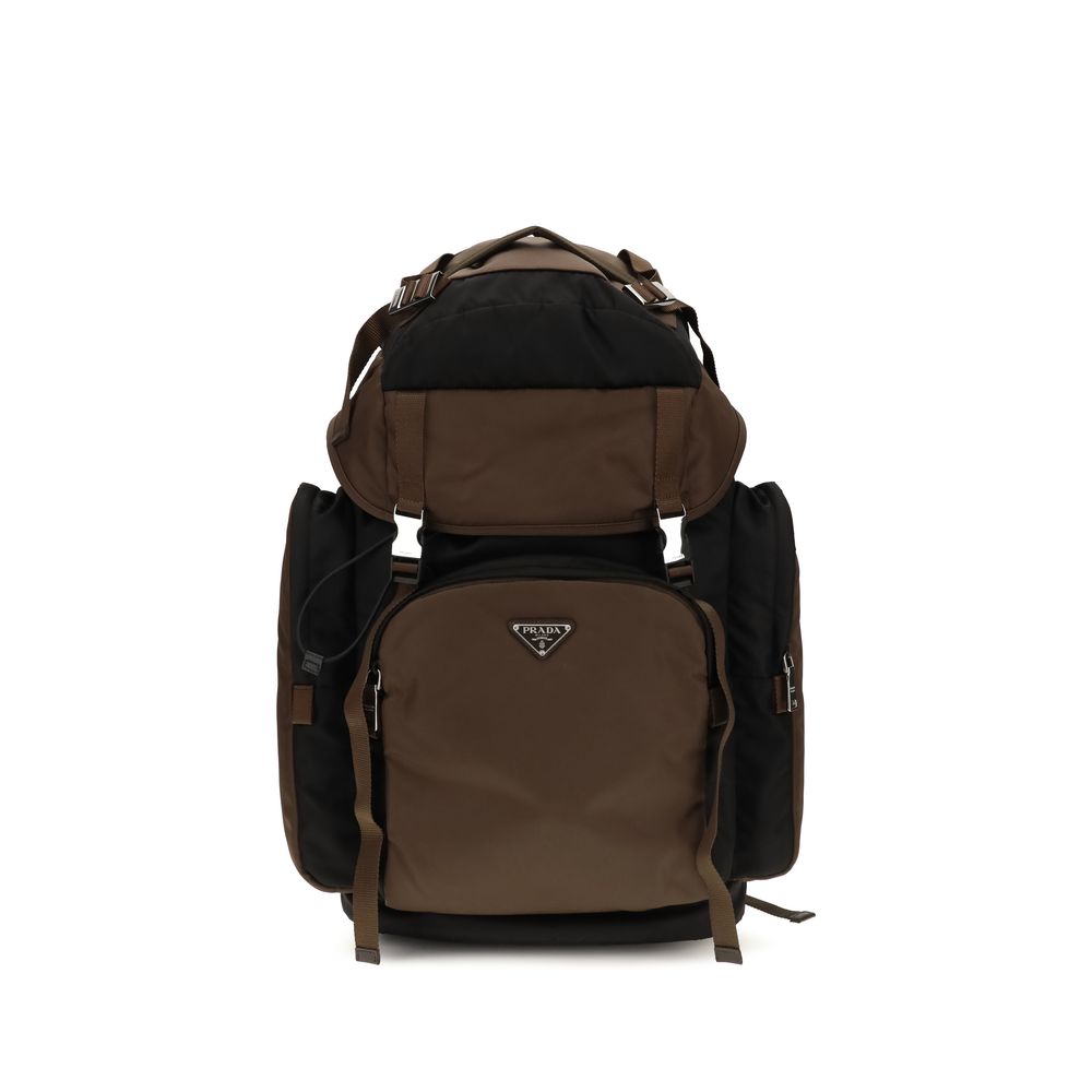 Prada Re-Nylon backpack in black with burnt orange accents, featuring side-release buckles, four external zipper pockets, and the triangle logo.