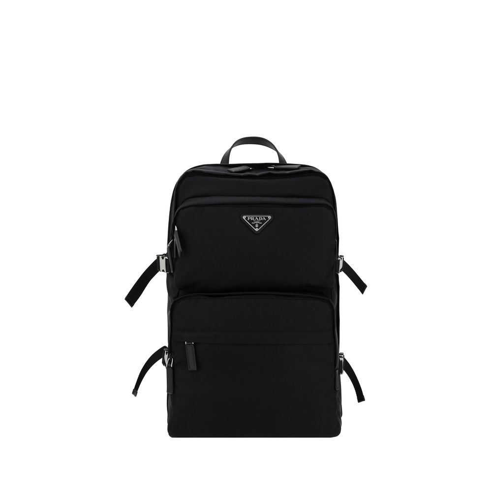 Prada Re-Nylon and Saffiano leather technical backpack in black with enameled triangle logo, zippered compartments, and side-release buckles.