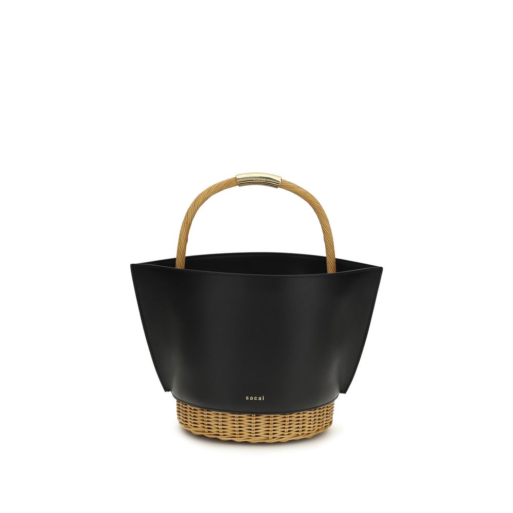 Sacai Leather and Rattan Basket Medium in Black, featuring gold logo handle, exclusive to The Exclusive Line Singapore.
