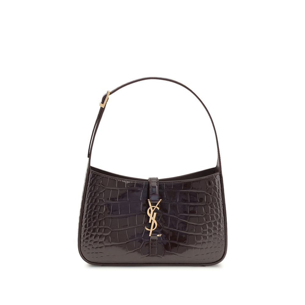 Saint Laurent Le 5 À 7 shoulder bag in Dark Aubergine crocodile-embossed patent leather with bronze CASSANDRE hardware.