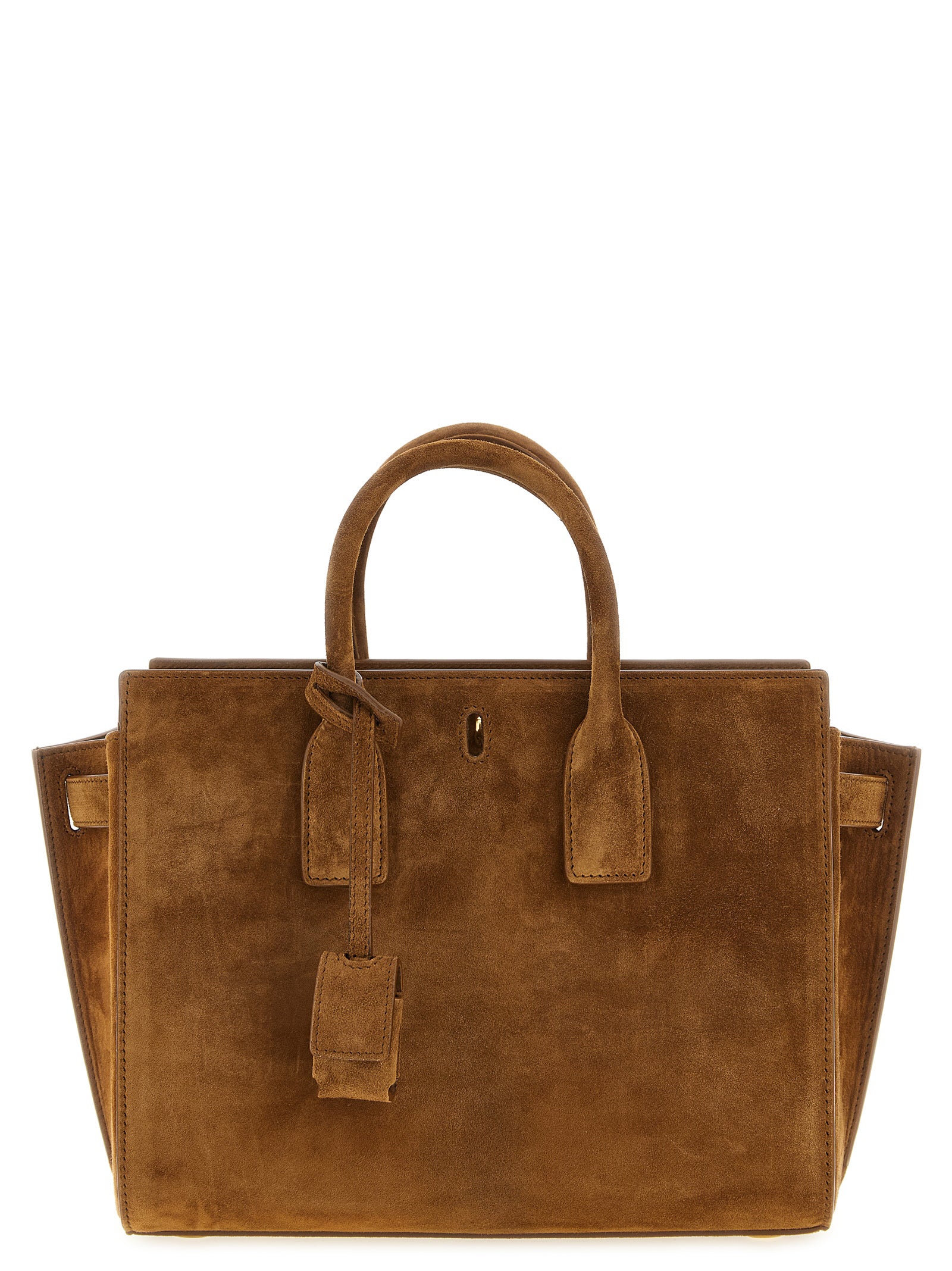 Saint Laurent Sac de Jour Small East/West bag in caramel cognac suede featuring structured top handles, accordion sides, and a bronze CASSANDRE padlock charm from The Exclusive Line Singapore.