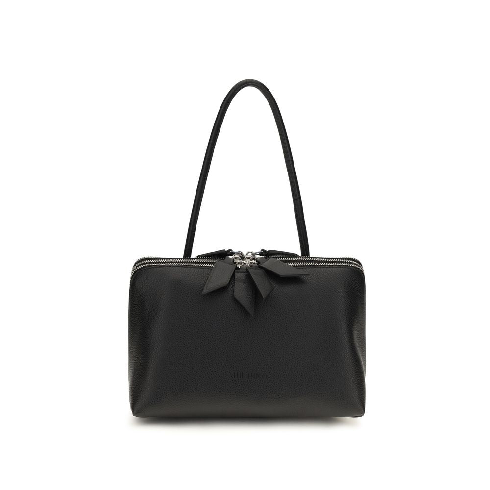 The Attico L'Altra di Milano Shoulder Bag in black grain-effect leather with red suede interior.