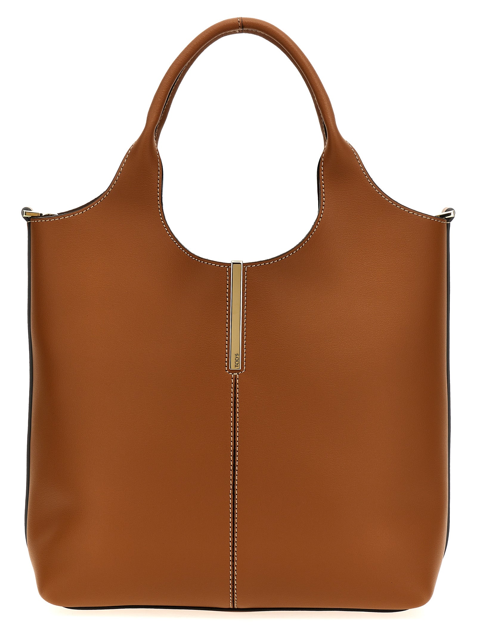 Tod's Small Shopping Bag in brown calfskin leather featuring vertical central stitching, a branded metal bar accessory, and a detachable shoulder strap from The Exclusive Line Singapore.