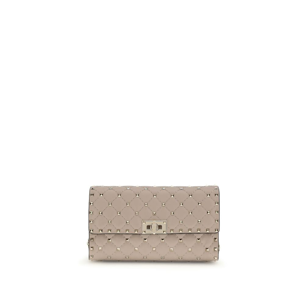 Valentino Garavani Rockstud Spike crossbody clutch bag in poudre quilted lambskin leather with platinum studs.