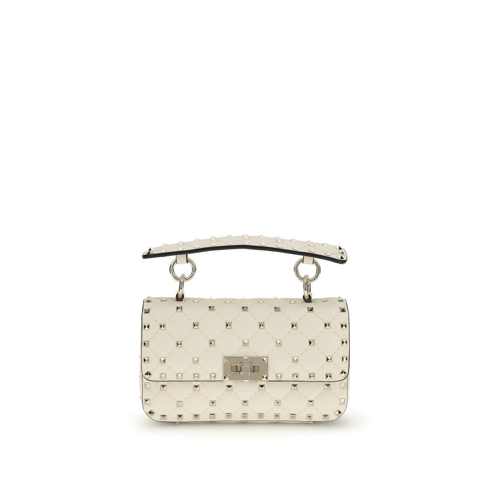Valentino Garavani Rockstud Spike Small Handbag in White color. Featuring quilted Nappa leather, platinum-finish studs, and a versatile multi-way carry system. Available in The Exclusive Line.
